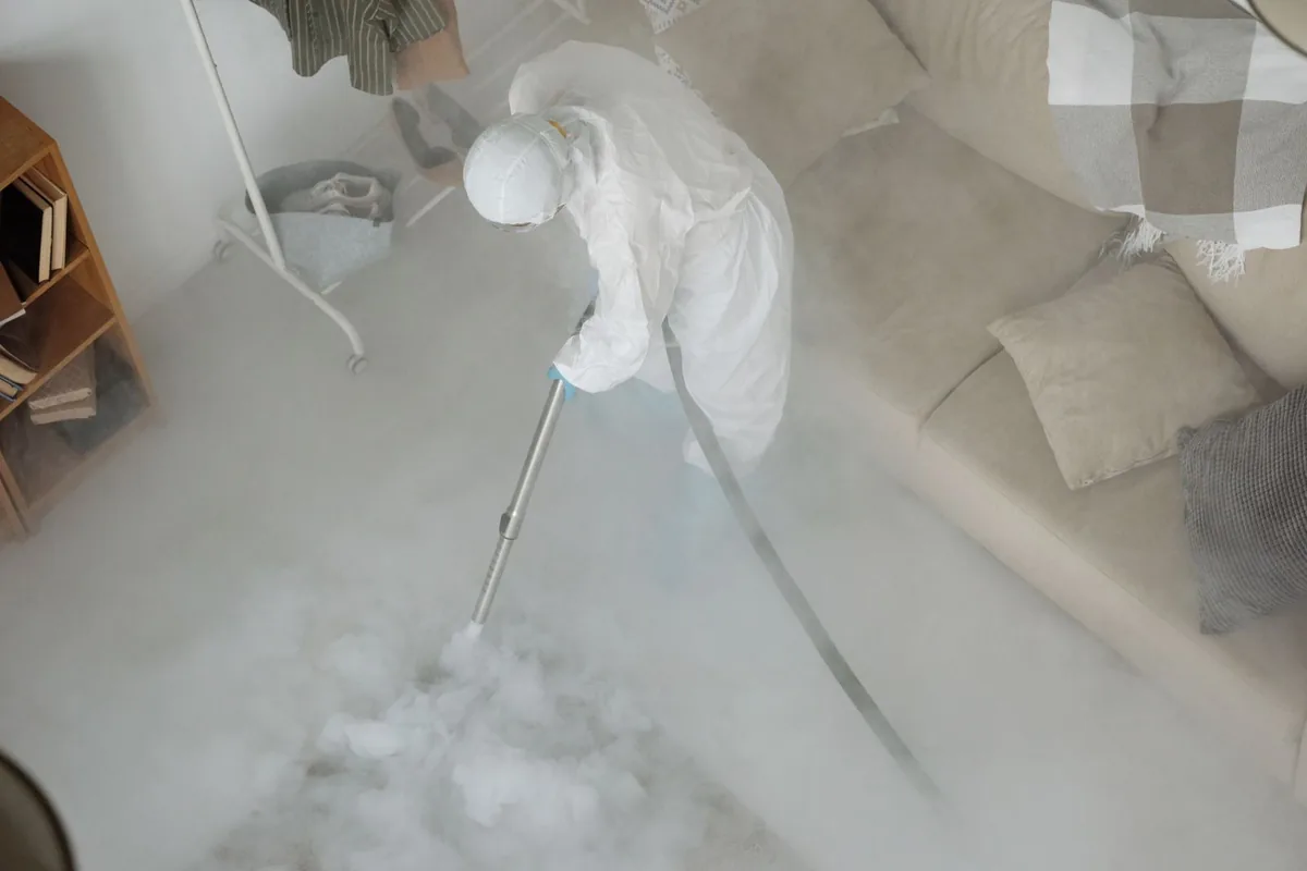 Biohazard cleanup technician in protective equipment, East Helena, MT